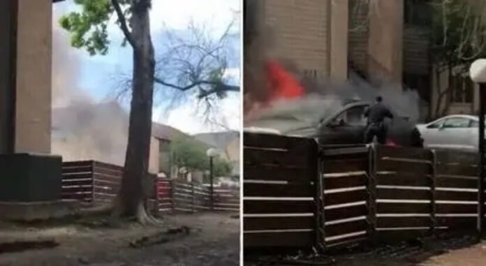 Policía salva a persona en auto en fuego