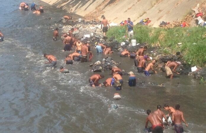 Los pescadores o mineros del Guaire